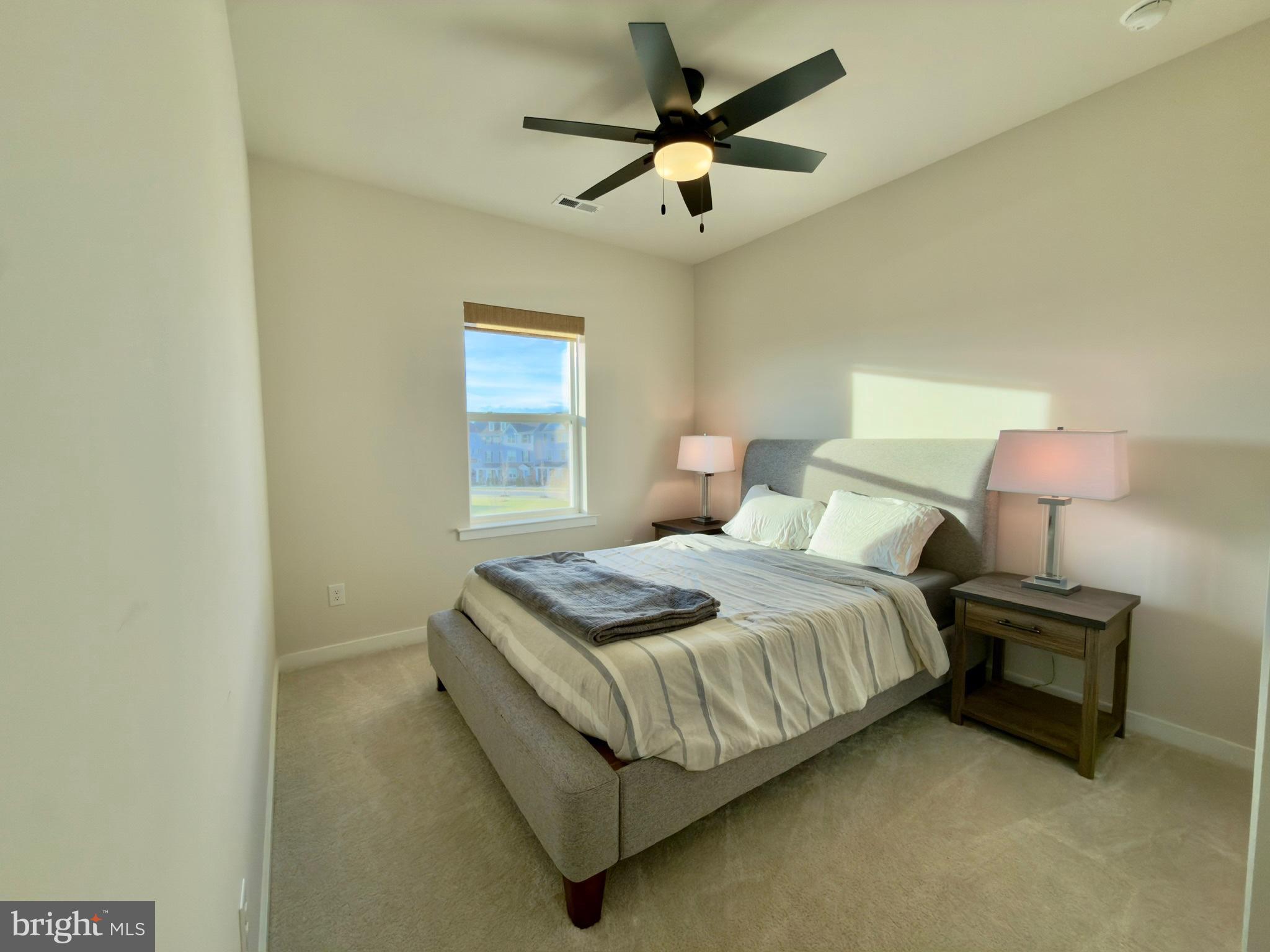 141 South Lore's Landing Road Middletown, DE 19709 - Photo 33 of 38 a bedroom with a bed chandelier and a window