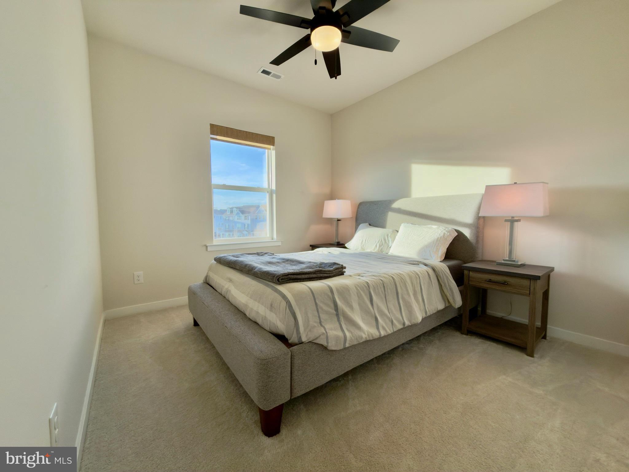 141 South Lore's Landing Road Middletown, DE 19709 - Photo 34 of 38 a bedroom with a bed and lamp