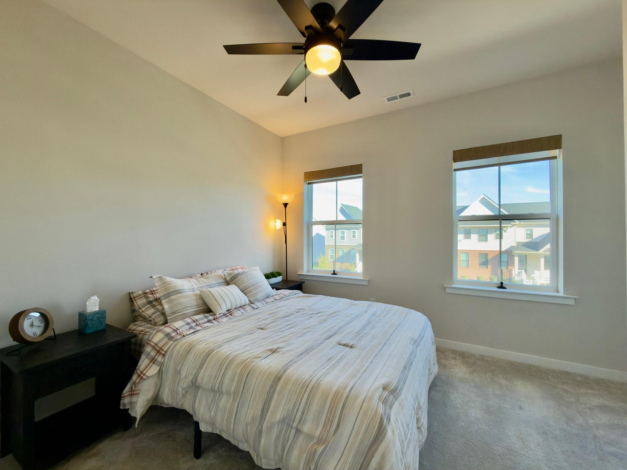 141 South Lore's Landing Road Middletown, DE 19709 - Photo 37 of 60 a bedroom with a bed and a chandelier