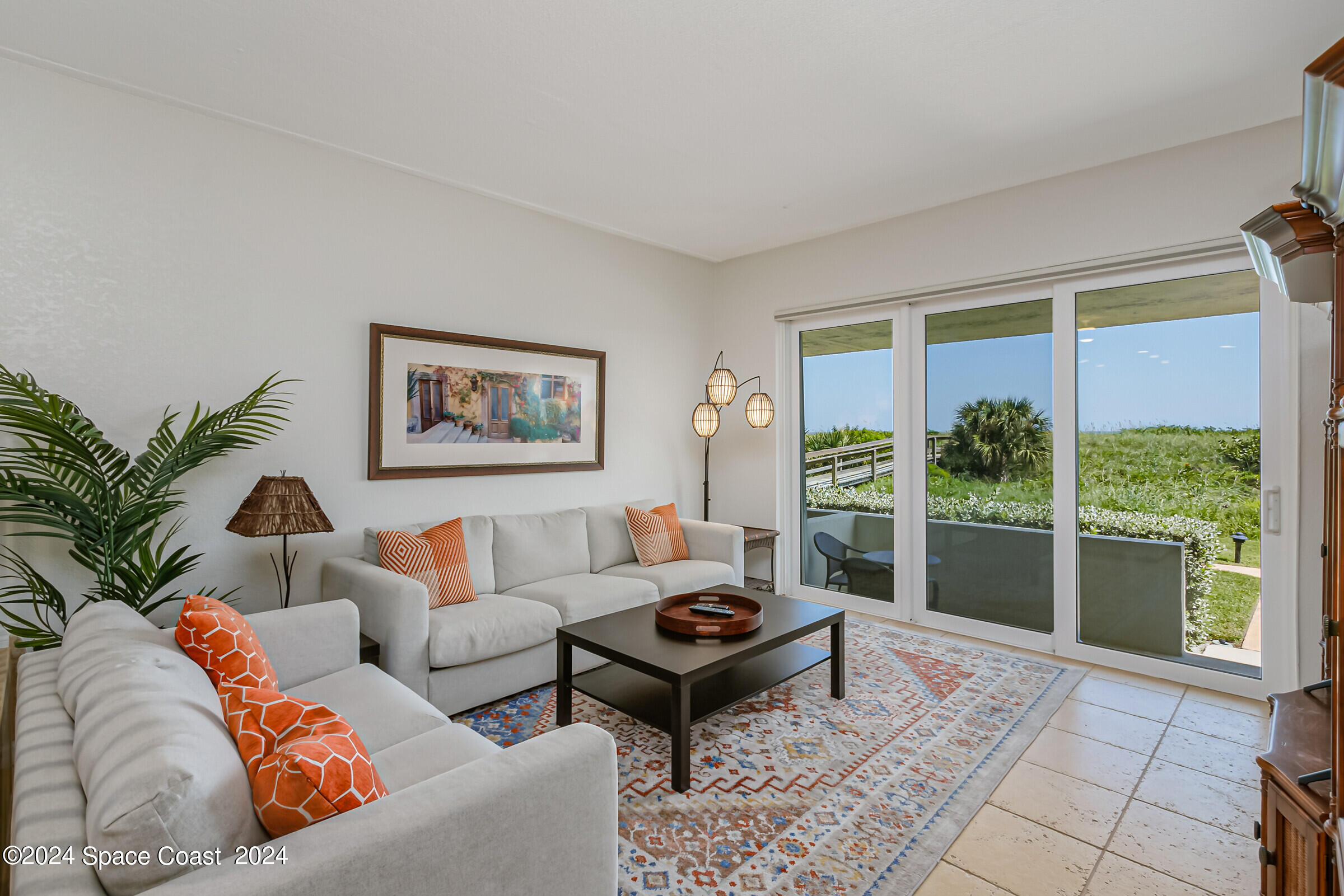5050 Ocean Beach Boulevard Cocoa Beach, FL 32931 - Photo 19 of 33 a living room with furniture and a large window