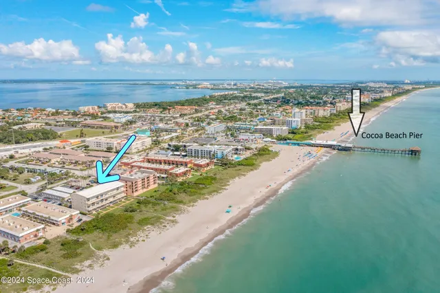 a view of an ocean and city