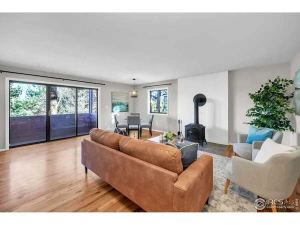 a kitchen with stainless steel appliances granite countertop a sink a stove and refrigerator