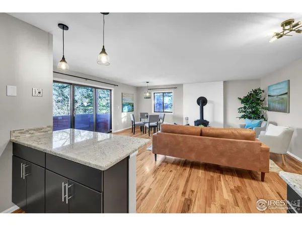 a kitchen with stainless steel appliances granite countertop a sink stove and microwave
