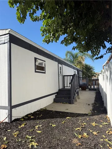 a view of a house with a tree