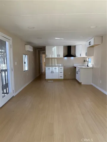 a living room with furniture and window