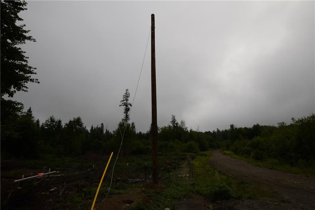 17 Mooseberry Road Wytopitlock, ME 04497 - Photo 19 of 22 Power poles are installed