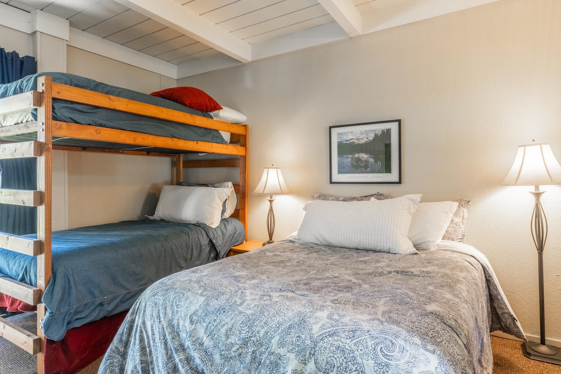3252 Chateau Road, Unit 18 Mammoth Lakes, CA 93546 - Photo 21 of 30 Bedroom featuring bunk beds and an additional bed, exposed beam ceiling, carpeted flooring, and wall
