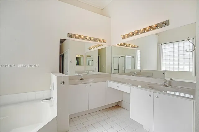 a bathroom with a bathtub and a sink