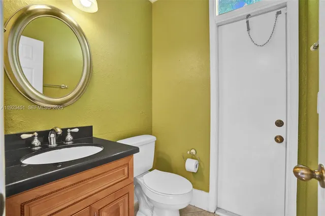 a large kitchen with a large counter top cabinets and stainless steel appliances