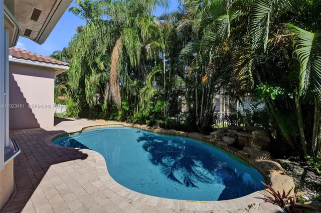 a house view with a backyard space