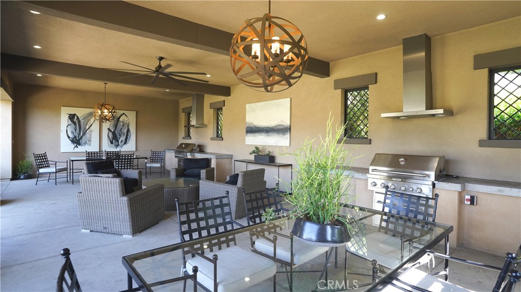 258 Bryce Run Lake Forest, CA 92630 - Photo 5 of 9 a view of a dining room with furniture a chandelier and wooden floor