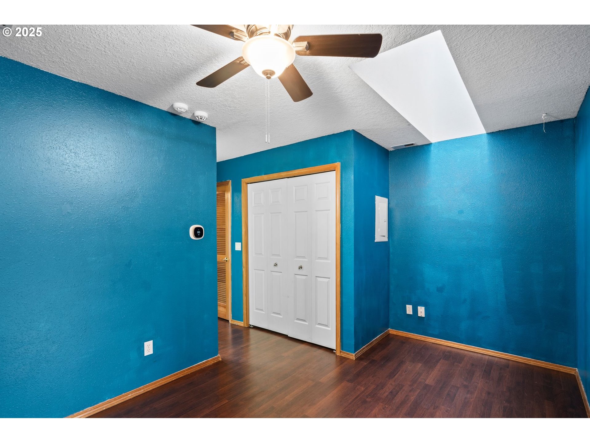 14134 East Burnside Street, Unit 2 Portland, OR 97233 - Photo 25 of 37 a view of an empty room with a fan
