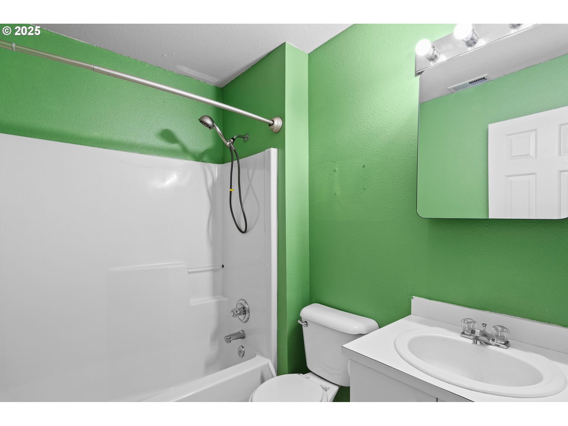 14134 East Burnside Street, Unit 2 Portland, OR 97233 - Photo 31 of 37 a bathroom with a sink and green walls