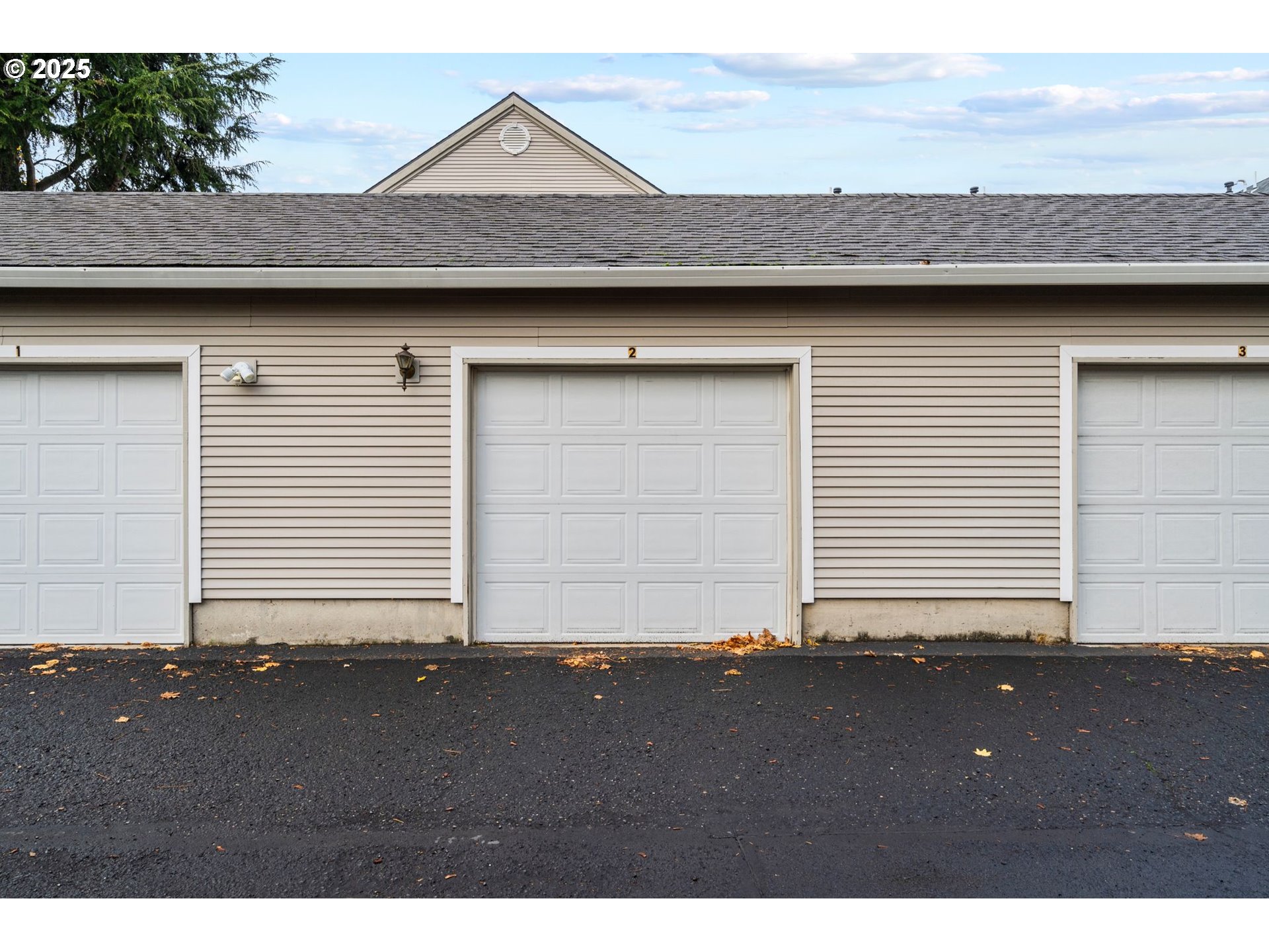 14134 East Burnside Street, Unit 2 Portland, OR 97233 - Photo 37 of 37 a view of a house with a garage