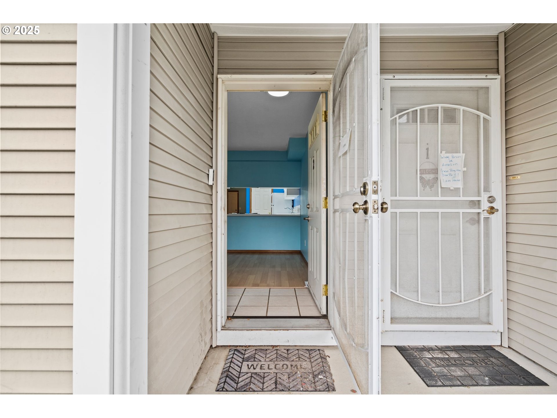 14134 East Burnside Street, Unit 2 Portland, OR 97233 - Photo 6 of 37 a view of a bedroom from a hallway