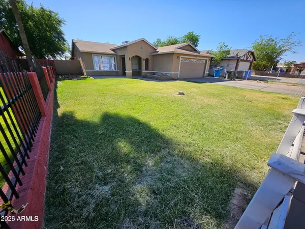 a view of a house with a yard patio and swimming pool