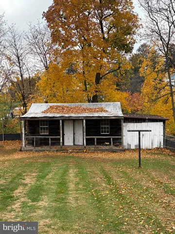 a view of house with swimming pool