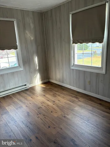 a view of a room with wooden walls