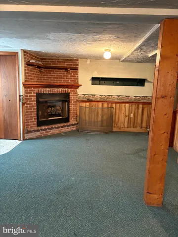 a view of fireplace and front door