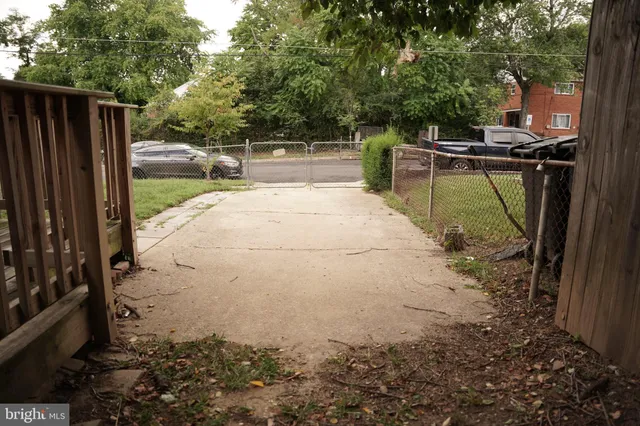 a view of a backyard with sitting area