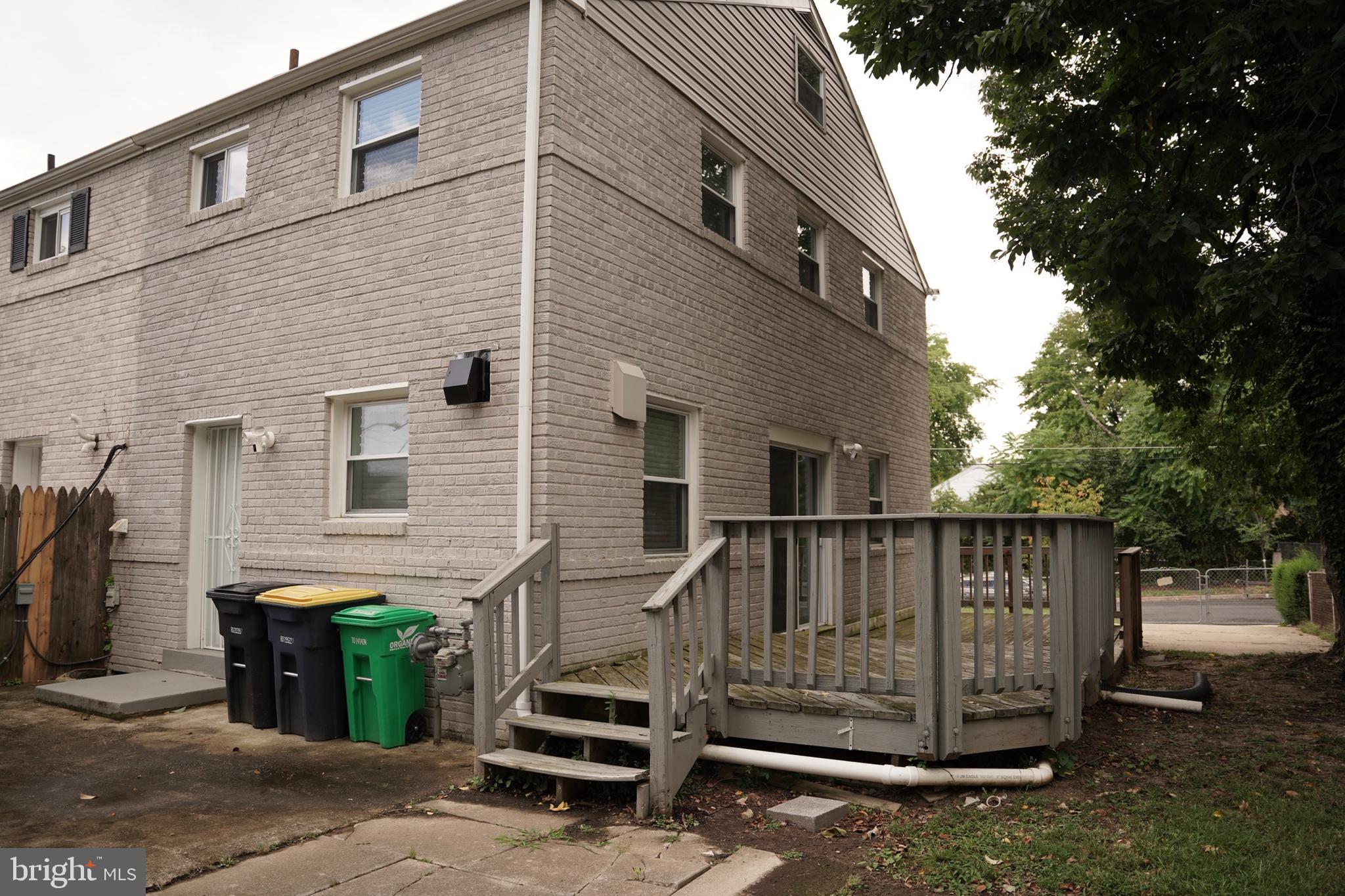 2230 Houston Street Suitland, MD 20746 - Photo 3 of 18 a view of a house with backyard and wooden fence