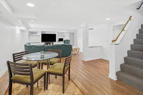 a room with water heater and a wooden floor