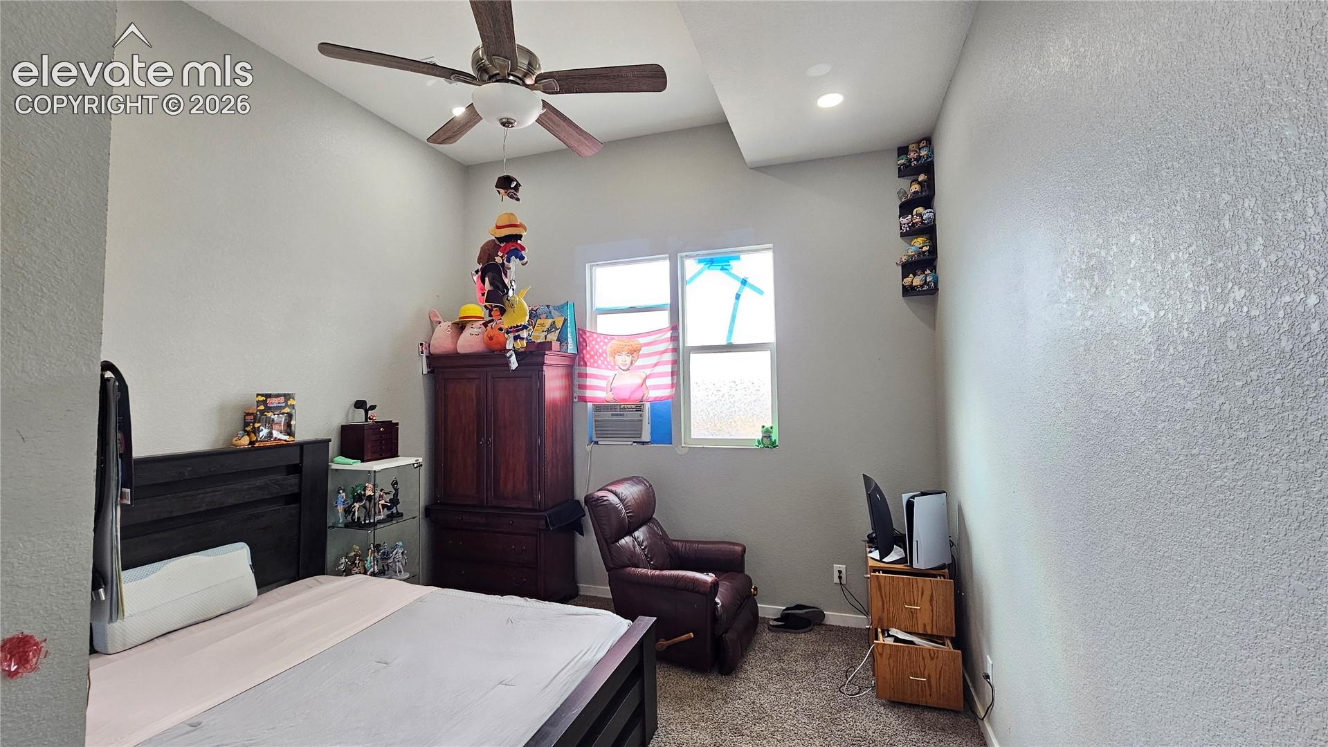 3835 Sengbeil Road Yoder, CO 80864 - Photo 27 of 48 Room featuring textured walls, a vaulted ceiling with a ceiling fan, and a recessed light fixture