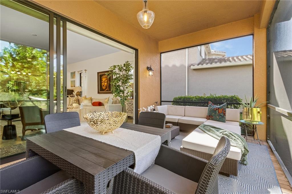 3063 Hudson Terrace Naples, FL 34119 - Photo 18 of 23 a living room with furniture and a large window