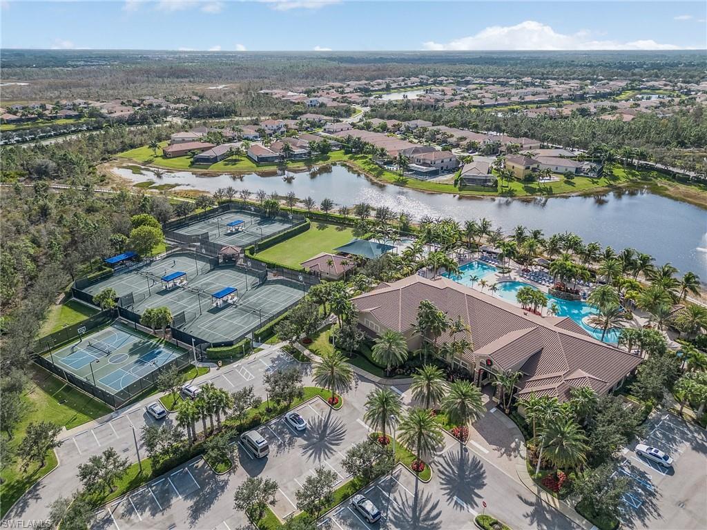 3063 Hudson Terrace Naples, FL 34119 - Photo 20 of 21 an aerial view of a city with lots of residential buildings ocean and mountain view in back
