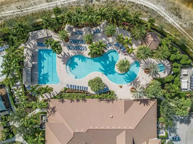an aerial view of a house with a garden and plants