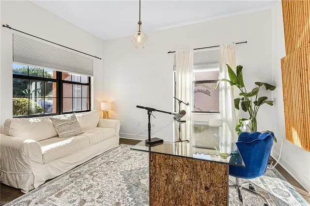 a living room with furniture and a window