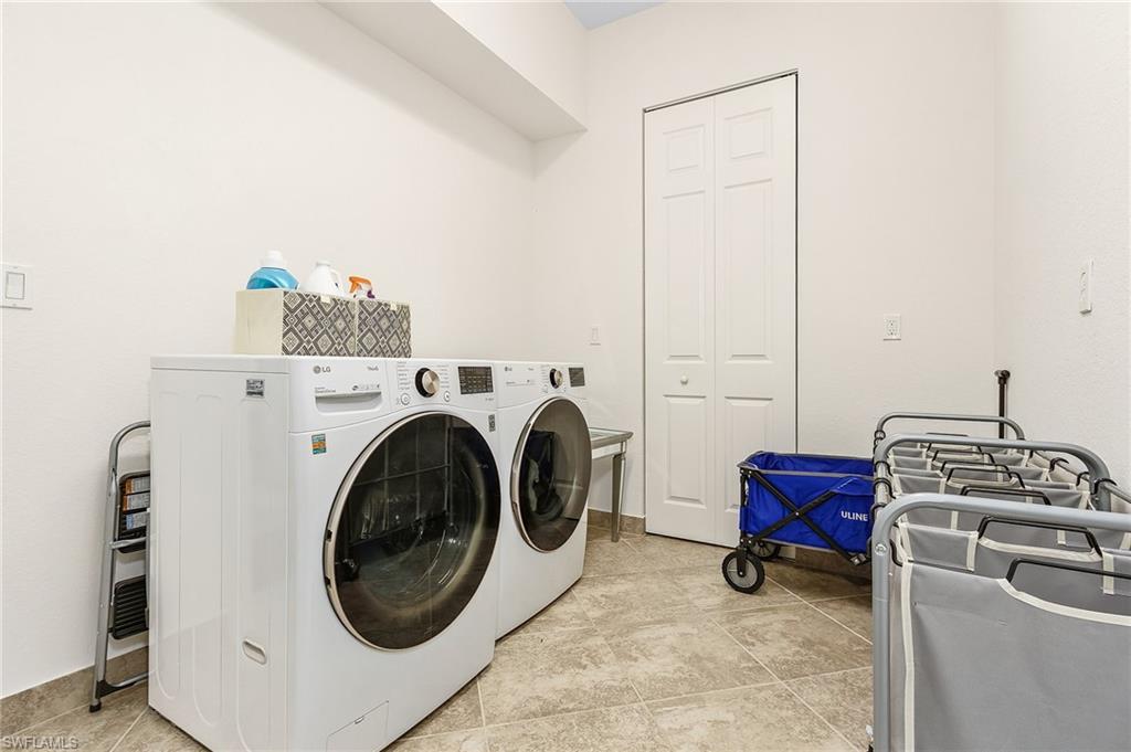 3063 Hudson Terrace Naples, FL 34119 - Photo 5 of 21 a utility room with dryer and washer