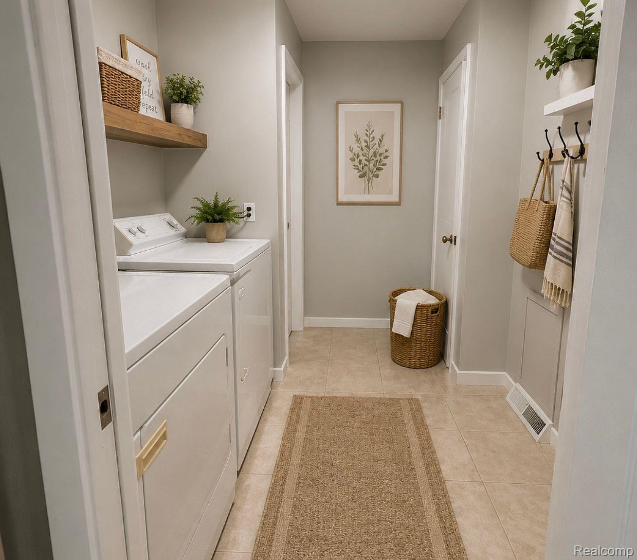 3520 Rayburn Road Bloomfield Hills, MI 48304 - Photo 13 of 26 Laundry area featuring tile flooring, a wall-mounted wood-finish shelf, and a wall-mounted coat rack