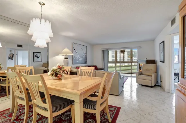 a bathroom with a shower sink and mirror