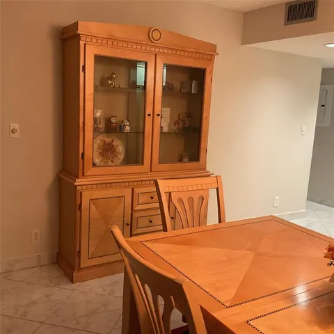 a view of a room with a ceiling fan