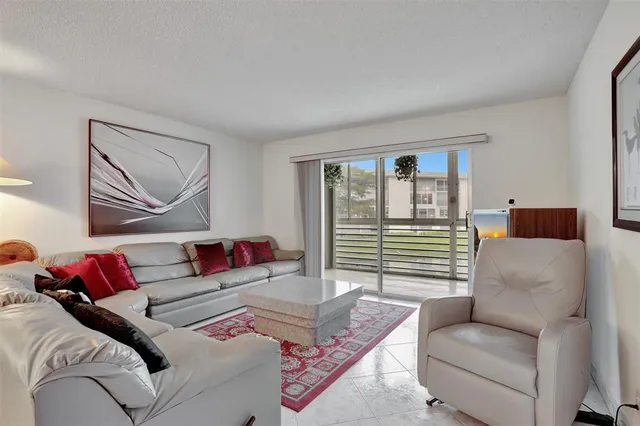 a view of a house with a yard porch and sitting area