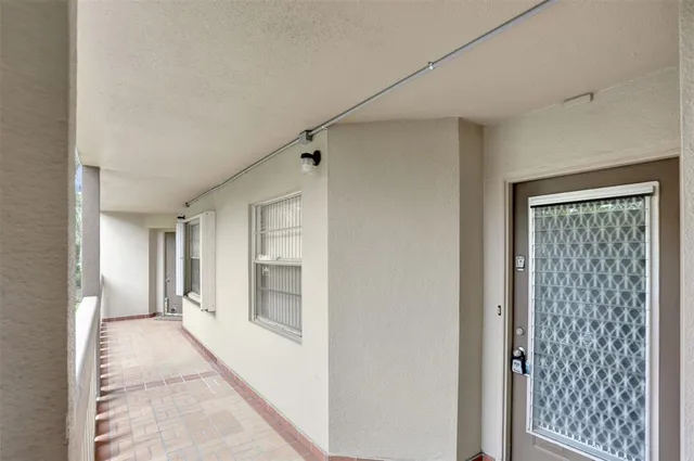 a living room with furniture city view and large windows