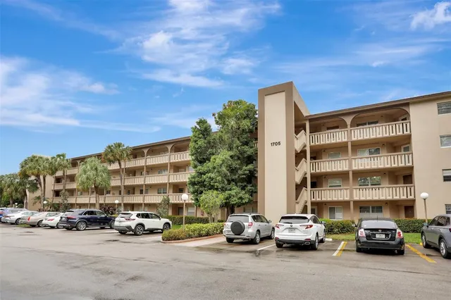 a view of park with large trees