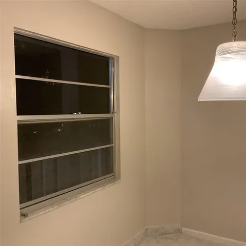 a kitchen with stainless steel appliances a stove a refrigerator and a sink