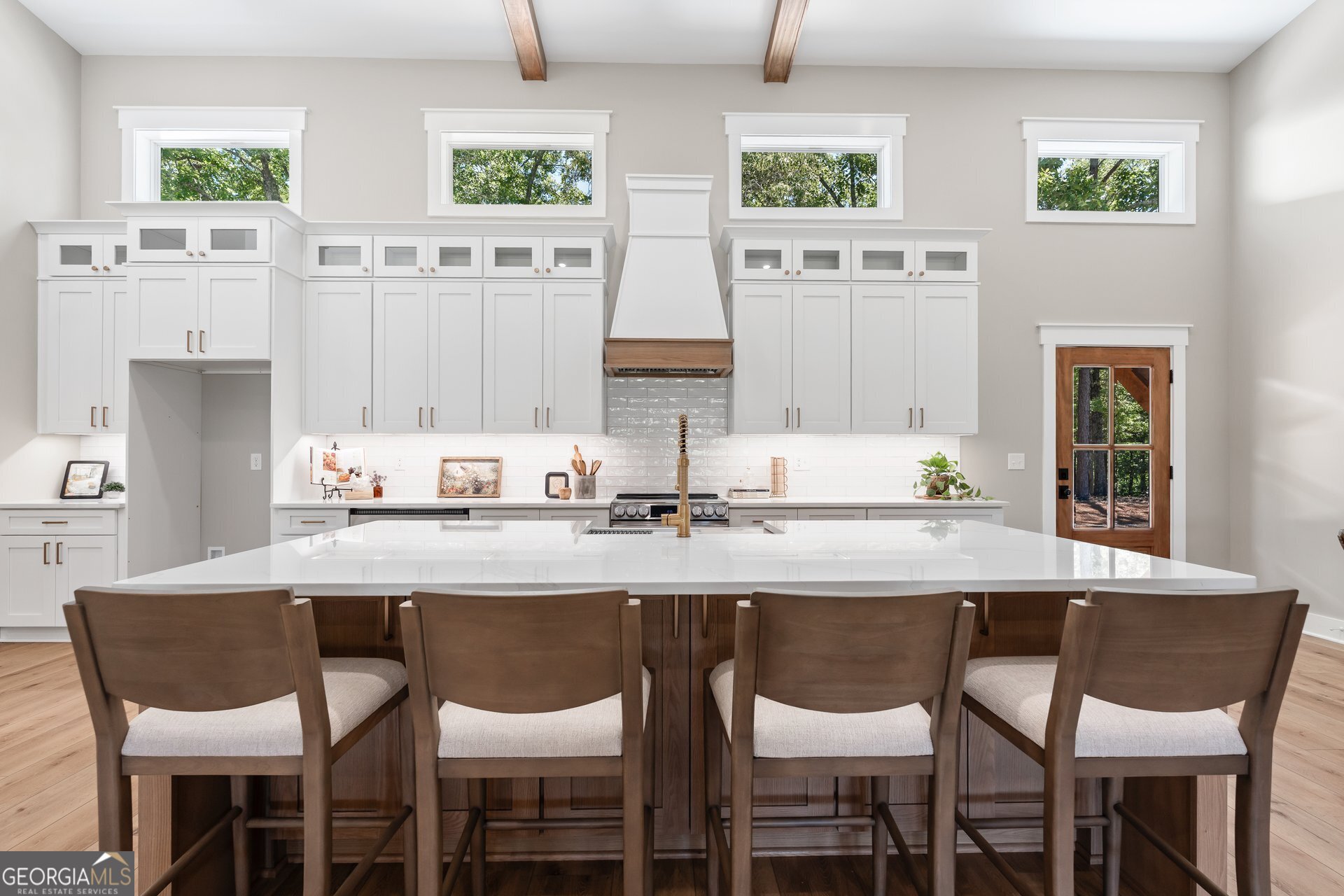 5938 Ridgeway Road Franklin, GA 30217 - Photo 10 of 41 a kitchen with a dining table chairs and large window