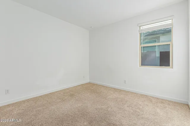 an empty room with closet area
