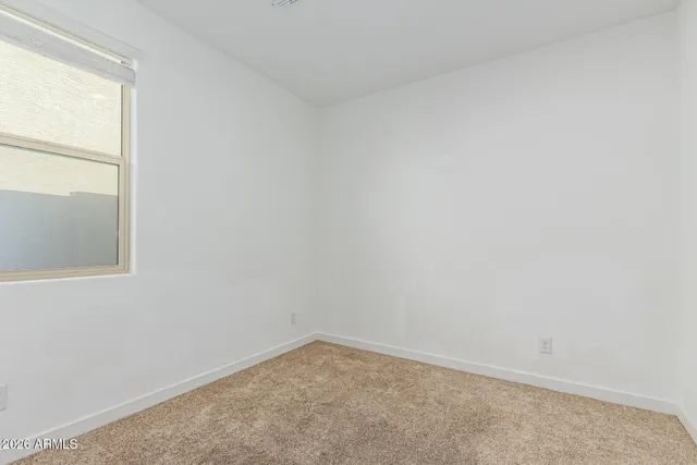 a big house with a big yard and large trees