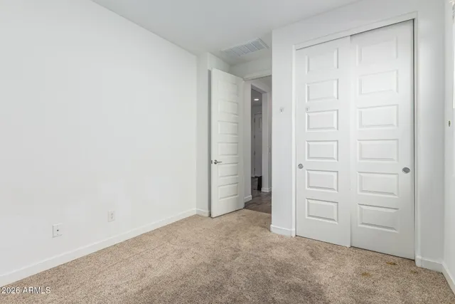 a picture of a wall with a white cabinet