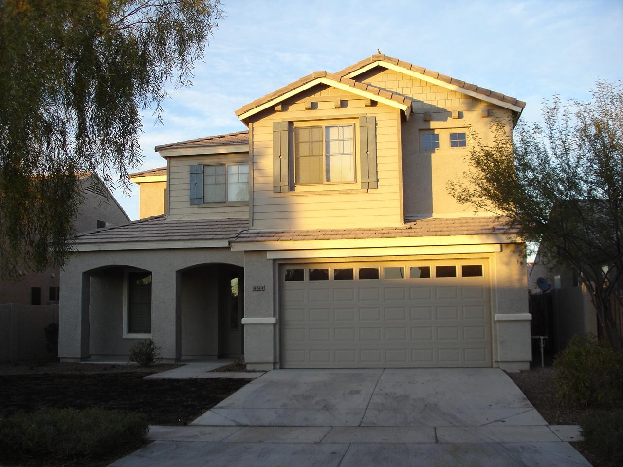 4744 East Timberline Road Gilbert, AZ 85297 - Photo 1 of 25 a front view of a house