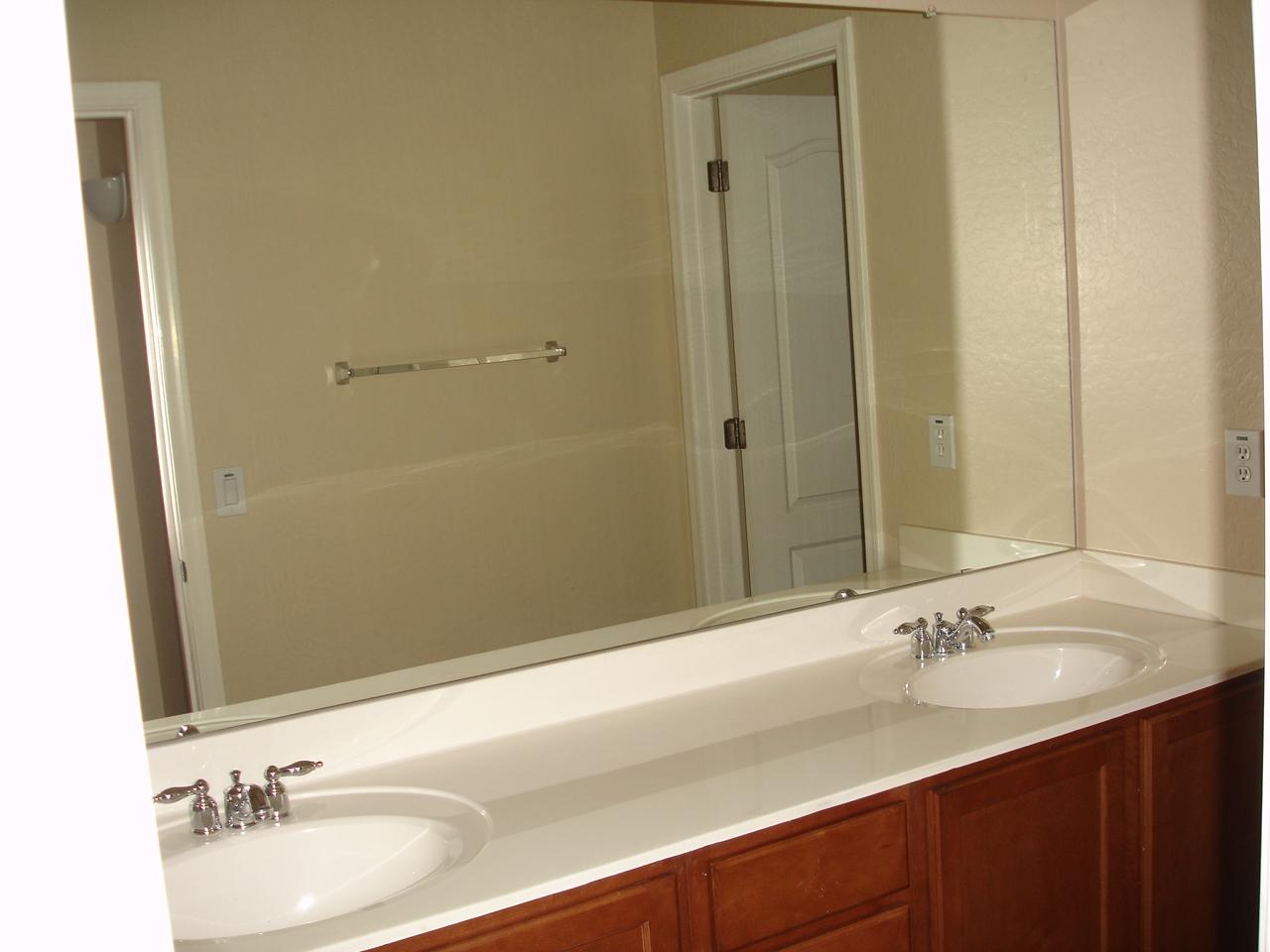 4744 East Timberline Road Gilbert, AZ 85297 - Photo 18 of 25 a bathroom with a granite countertop sink and a mirror
