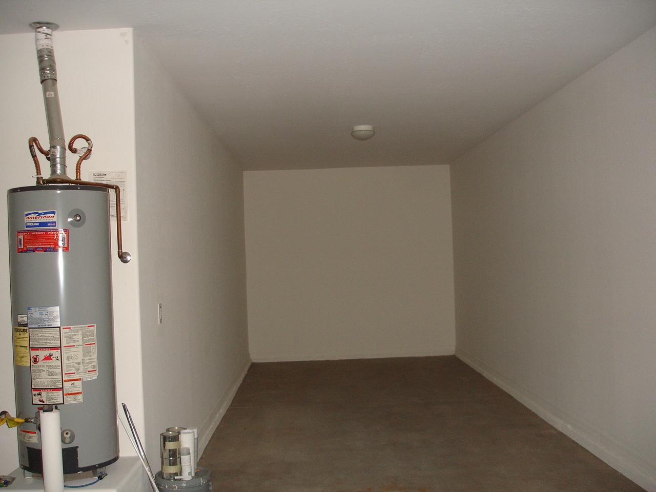 4744 East Timberline Road Gilbert, AZ 85297 - Photo 23 of 25 an empty room with water heater on the wall