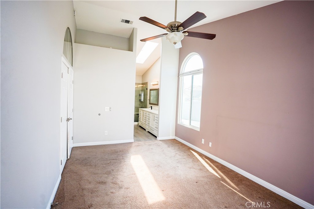 7562 Webster Street Highland, CA 92346 - Photo 12 of 30 an empty room with windows and fan