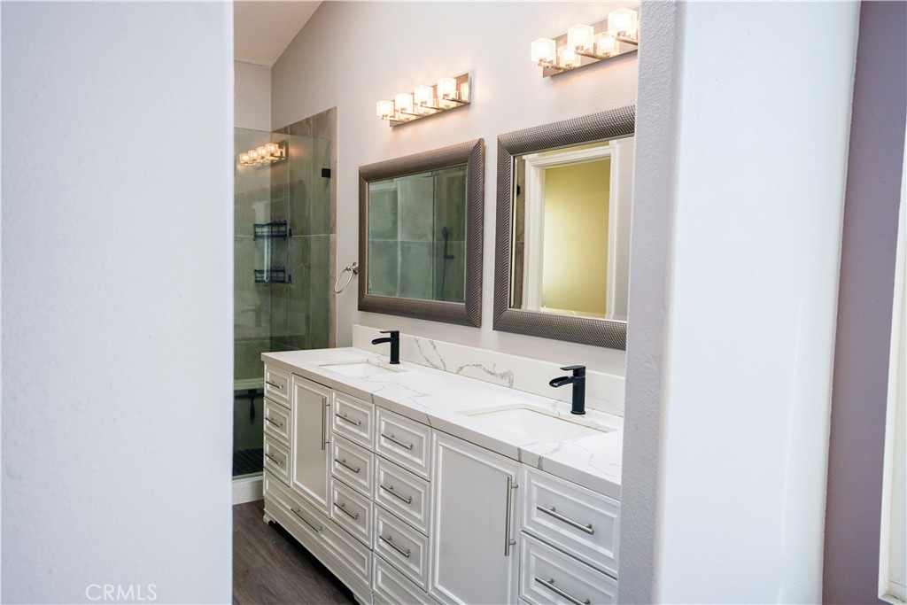 7562 Webster Street Highland, CA 92346 - Photo 14 of 30 a bathroom with a sink and a mirror