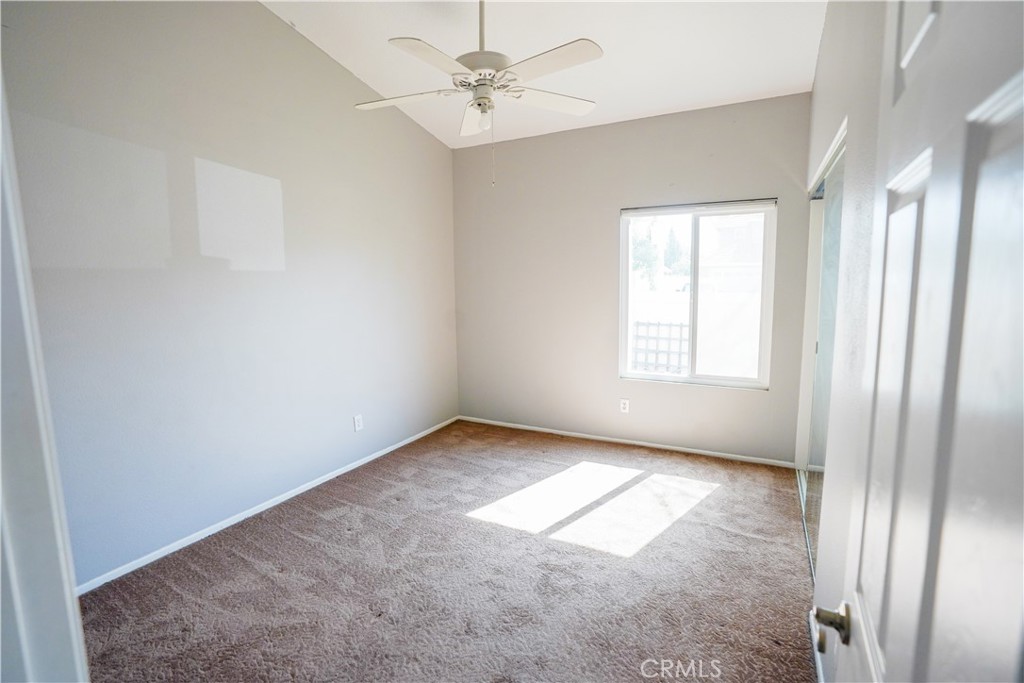 7562 Webster Street Highland, CA 92346 - Photo 18 of 30 an empty room with windows and fan