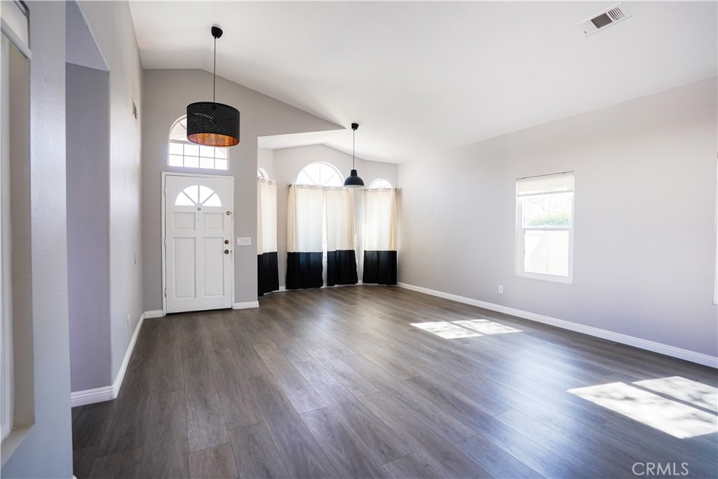 7562 Webster Street Highland, CA 92346 - Photo 22 of 30 a view of a room with window and wooden floor